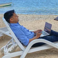 Working on a laptop at the beach