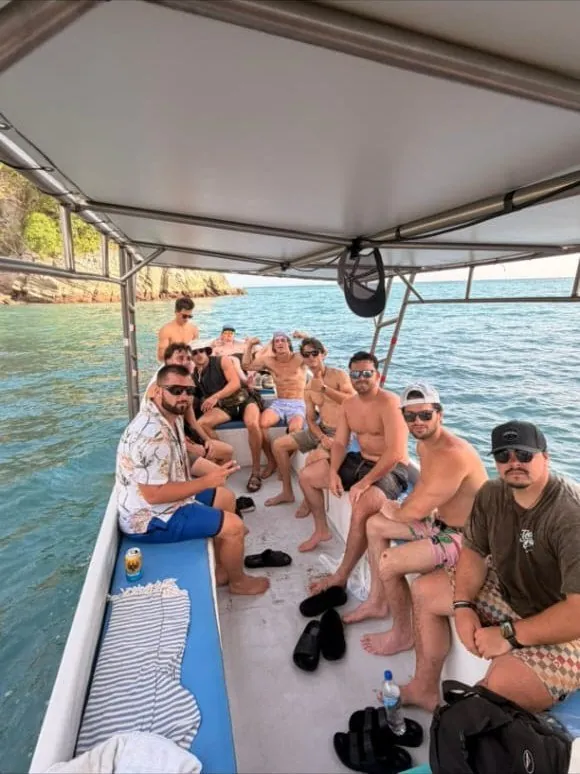 Group of friends on the boat to Isla Tortuga